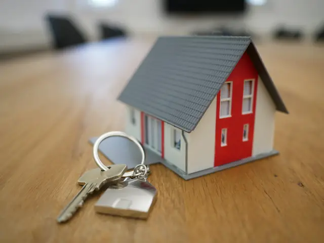 House keys on a listing file — the last step after paper is clean.